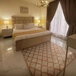 Elegant Deco Beige Upholstered Bed with Luxury Gold Lighting Accents – Hotel Style - Image 1