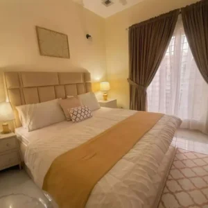 Elegant Deco Beige Upholstered Bed with Luxury Gold Lighting Accents – Hotel Style - Image 2